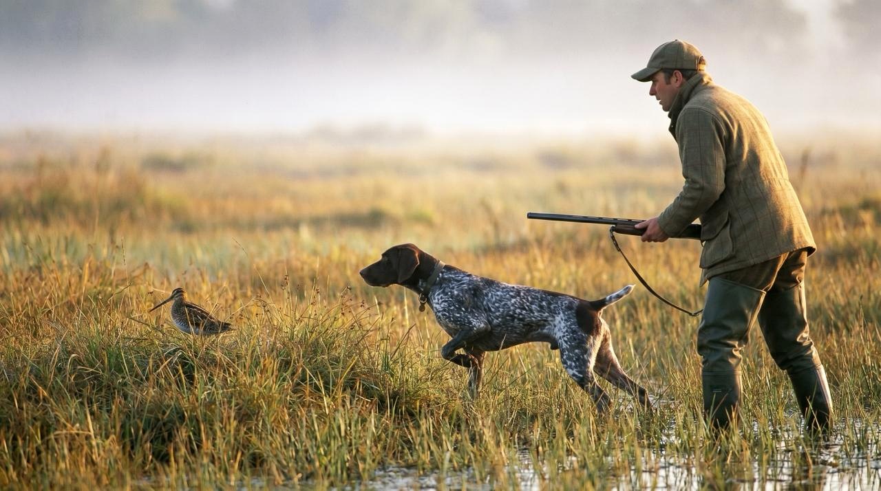 Охотник с собакой